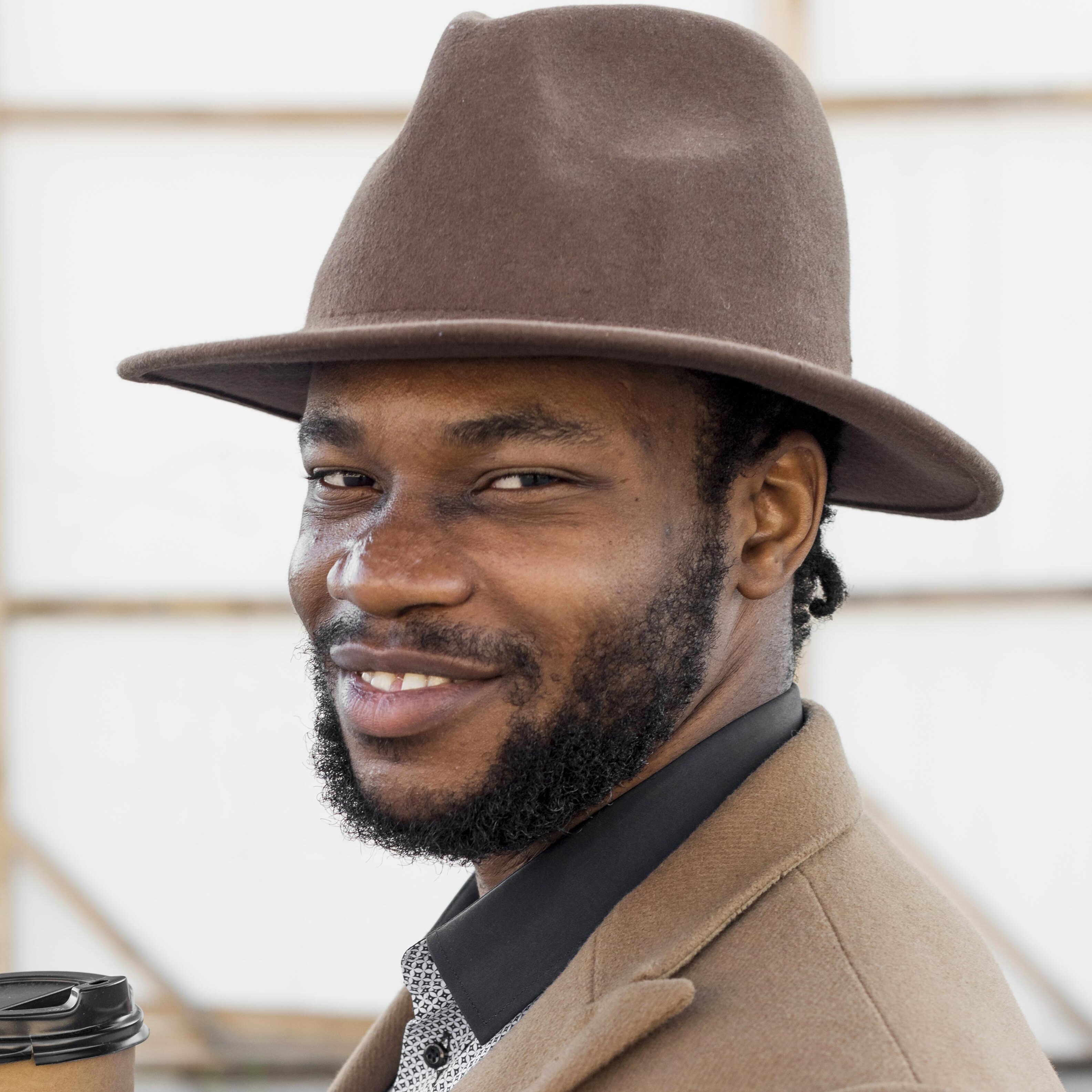 side-view-stylish-african-american-man-holding-cup-coffee